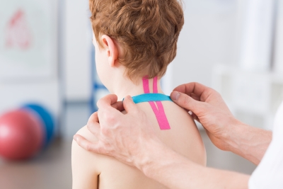 doctor working on child spine